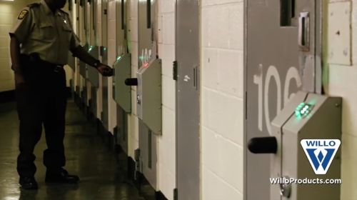 A corrections officer checks doors at Fulton County Jail.